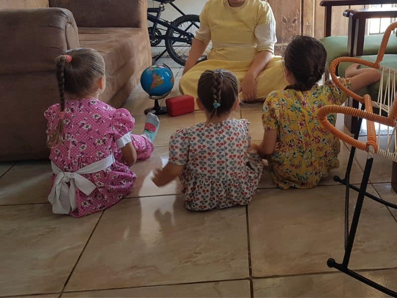 mom and girls sitting on the floor