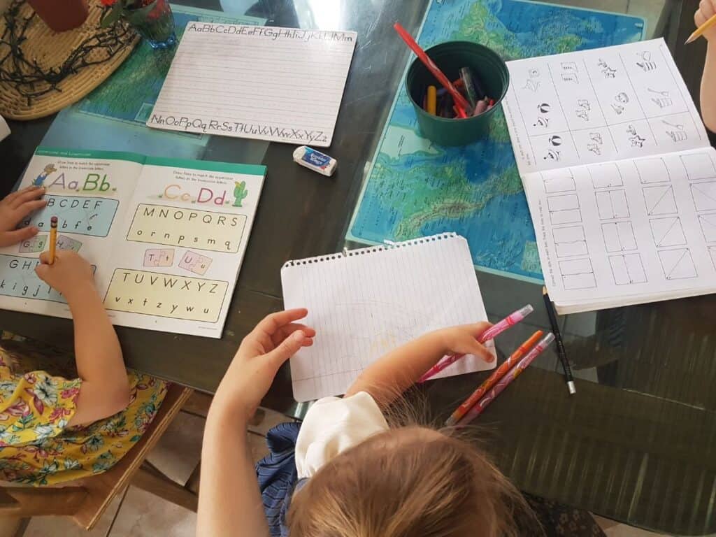 preschoolers working on workbooks