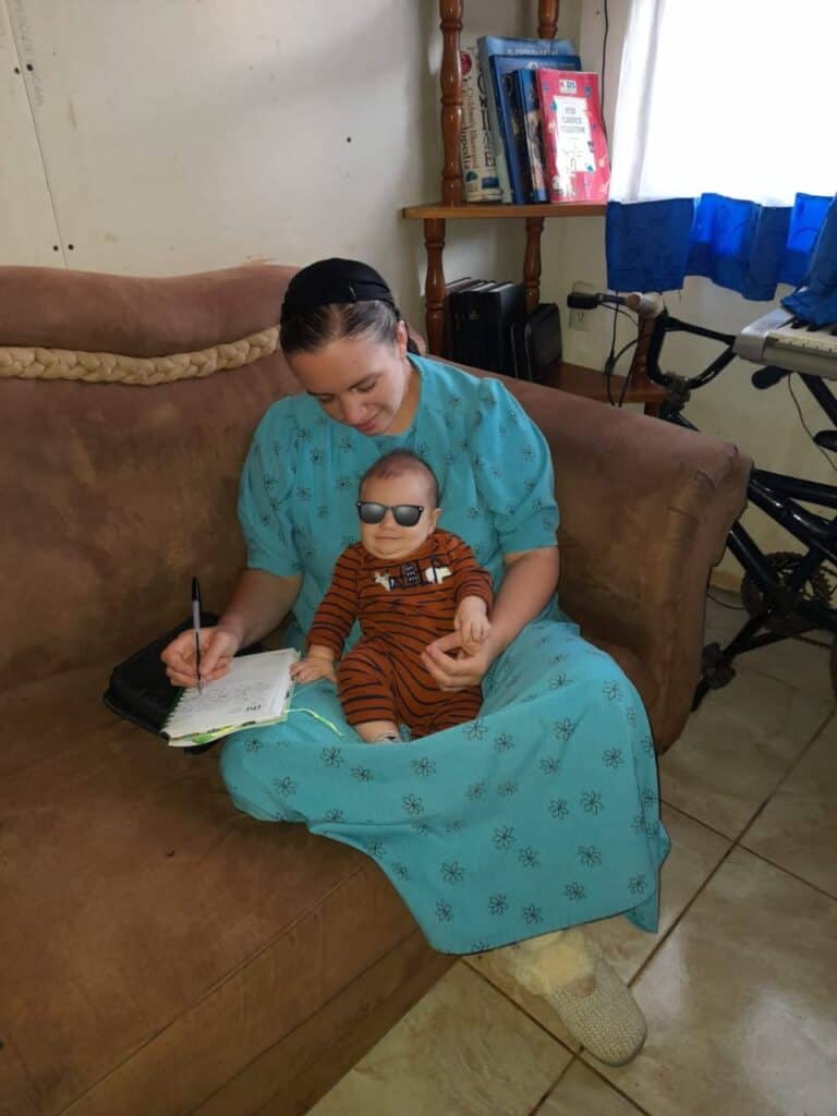 baby on mom's lap for Bible time