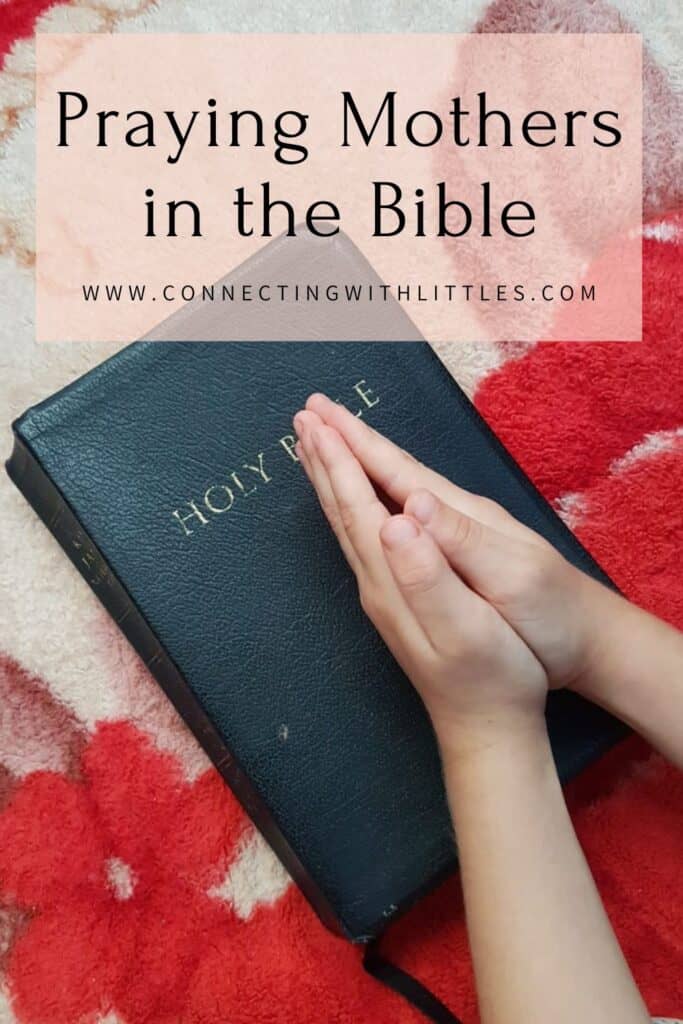 praying hands over a Bible pin
