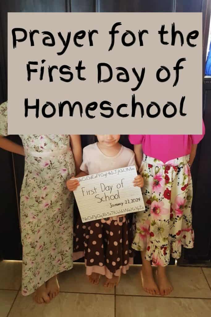 girls holding first day of school sign pin