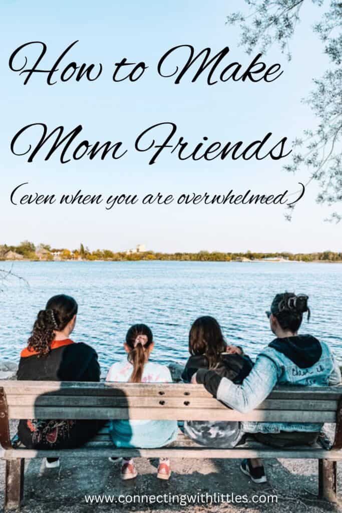 two moms with daughters on a bench overlooking a lake