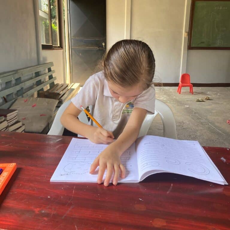 girl working in school workbook